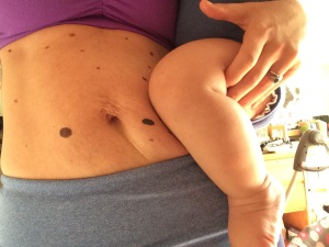 My belly...after 41 weeks of pregnancy and now holding my 41 week old baby in arms.